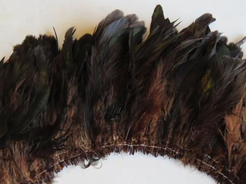 Royal green strung feathers dyed rich brown closeup